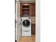 Laundry room with washer, dryer, and additional storage at 100 Detroit St # 406, Denver, CO 80206