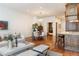 Open concept living area with hardwood floors, kitchen, and dining area at 100 Detroit St # 406, Denver, CO 80206