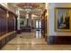 Elegant lobby with dark wood, tiled floors, and artwork at 100 Detroit St # 406, Denver, CO 80206
