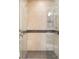 Walk-in shower with glass enclosure and dark tile at 100 Detroit St # 406, Denver, CO 80206