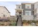 Two story home exterior with gray siding and stone accents at 8258 Mount Ouray Rd, Littleton, CO 80125