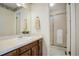 Clean bathroom with a vanity, large mirror, and a shower/tub combination at 652 Mountain Chickadee Rd, Highlands Ranch, CO 80126