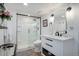 Modern bathroom with a glass shower, toilet and floating vanity at 652 Mountain Chickadee Rd, Highlands Ranch, CO 80126