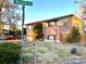 Side view of a brick ranch house with a spacious yard at 13003 E Nevada Ave, Aurora, CO 80012