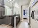 Bathroom with shower, vanity, and view into bedroom at 1854 Jules Ln, Louisville, CO 80027
