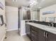 Double vanity bathroom with granite countertop and large shower at 1854 Jules Ln, Louisville, CO 80027