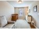 Neutral Bedroom with crib, changing table and armchair at 1854 Jules Ln, Louisville, CO 80027