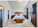 Spacious bedroom with carpeted floor, large window, and ensuite bathroom access at 1854 Jules Ln, Louisville, CO 80027