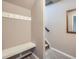 Entryway with bench, hooks, and mirror at 1854 Jules Ln, Louisville, CO 80027