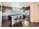 Modern kitchen with granite countertops, stainless steel appliances, and breakfast bar at 1854 Jules Ln, Louisville, CO 80027