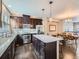Modern kitchen boasts granite countertops, stainless steel appliances, and an island at 1854 Jules Ln, Louisville, CO 80027