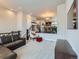 Spacious living room with plush leather sectional sofa and lots of natural light at 1854 Jules Ln, Louisville, CO 80027