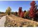 Neighborhood walking path with fall foliage at 1854 Jules Ln, Louisville, CO 80027