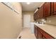 Laundry room with washer, dryer, cabinets, and utility sink at 16628 E 106Th Dr, Commerce City, CO 80022