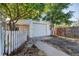 Detached garage with driveway and fenced yard at 252 S Owens St, Byers, CO 80103