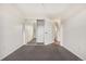 Well-lit bedroom featuring mirrored closet doors at 4824 Chandler Ct, Denver, CO 80239