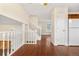 Hardwood floors and staircase view from living room at 4824 Chandler Ct, Denver, CO 80239