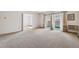 Spacious living room featuring carpet, access to other rooms and balcony at 495 S Dayton St # 10C, Denver, CO 80247
