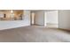Open living room with views into kitchen and dining area at 495 S Dayton St # 10C, Denver, CO 80247