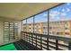 Private balcony overlooking building and trees at 495 S Dayton St # 10C, Denver, CO 80247