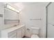 Clean bathroom with a vanity, toilet and shower at 495 S Dayton St # 10C, Denver, CO 80247