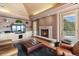 Gathering room with a fireplace and built-in shelving at 1682 Montane E Dr, Golden, CO 80401