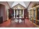 Home office with built-in bookshelves and French doors leading to patio at 1682 Montane E Dr, Golden, CO 80401