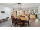 Basement dining room with a large wooden table and kitchen access at 1682 Montane E Dr, Golden, CO 80401