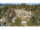 Luxury home situated on a hillside with mountain views and mature trees at 1682 Montane E Dr, Golden, CO 80401