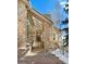 Stone exterior with a covered entryway and landscaping at 1682 Montane E Dr, Golden, CO 80401