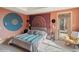 Bright bedroom with private access to patio, featuring unique wall decor and comfortable bedding at 1682 Montane E Dr, Golden, CO 80401