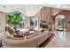 Spacious living room with stone fireplace and large windows with scenic views at 1682 Montane E Dr, Golden, CO 80401