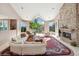 Bright living room with large windows, fireplace and seating area at 1682 Montane E Dr, Golden, CO 80401