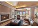 Cozy living room features a fireplace and views at 1682 Montane E Dr, Golden, CO 80401
