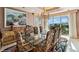 Elegant dining room with glass-top table and scenic views at 1682 Montane E Dr, Golden, CO 80401