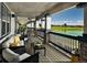 Relaxing community patio overlooking a lake and golf course at 16686 E 110Th Ave, Commerce City, CO 80022