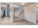 Clean and modern staircase with white railing at 26446 Grateful Way, Kittredge, CO 80457