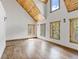 Bright bedroom with vaulted wood ceilings and large windows at 733 Rainbow Rd, Idaho Springs, CO 80452