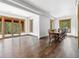 Open dining room with large table and access to a patio at 733 Rainbow Rd, Idaho Springs, CO 80452