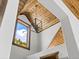 High ceiling detail with wood beams and a rustic chandelier at 733 Rainbow Rd, Idaho Springs, CO 80452