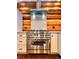 Modern stainless steel range and hood in a log cabin kitchen at 733 Rainbow Rd, Idaho Springs, CO 80452