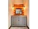 Bathroom vanity with granite countertop and log cabin accents at 733 Rainbow Rd, Idaho Springs, CO 80452