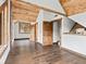 Bright bedroom with wood floors and vaulted ceilings, offering access to additional rooms at 733 Rainbow Rd, Idaho Springs, CO 80452