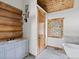 Bathroom with freestanding tub, walk-in shower, and wood vanity at 733 Rainbow Rd, Idaho Springs, CO 80452