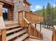 Steps leading up to a spacious wooden deck overlooking a mountain view at 733 Rainbow Rd, Idaho Springs, CO 80452