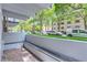 Private patio with brick flooring, offering a view of the street and landscaping at 555 E 10Th Ave # 3, Denver, CO 80203