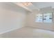 Spacious bedroom with neutral carpeting and large window at 555 E 10Th Ave # 3, Denver, CO 80203