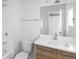 Clean bathroom with a vanity, toilet, and shower at 5570 W 11Th Pl, Lakewood, CO 80214