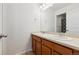 Clean bathroom with double vanity and a large mirror at 5694 Pinto Valley St, Parker, CO 80134