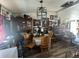 Charming dining area with wood floors, chandelier and artwork at 6631 78Th Ave, Commerce City, CO 80022